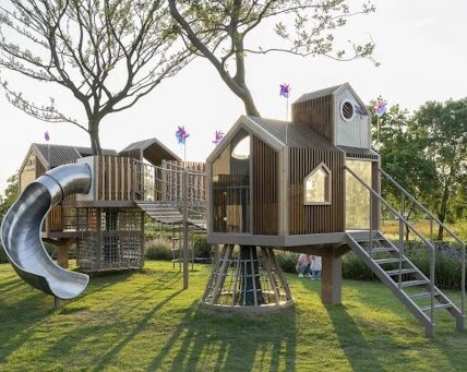 Modern playground design in a residential property development with safe and inclusive outdoor play equipment.