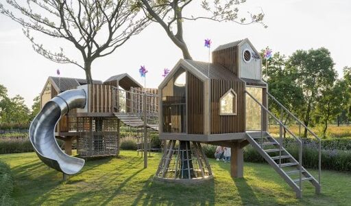Modern playground design in a residential property development with safe and inclusive outdoor play equipment.