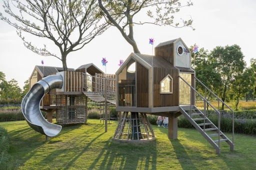 Modern playground design in a residential property development with safe and inclusive outdoor play equipment.